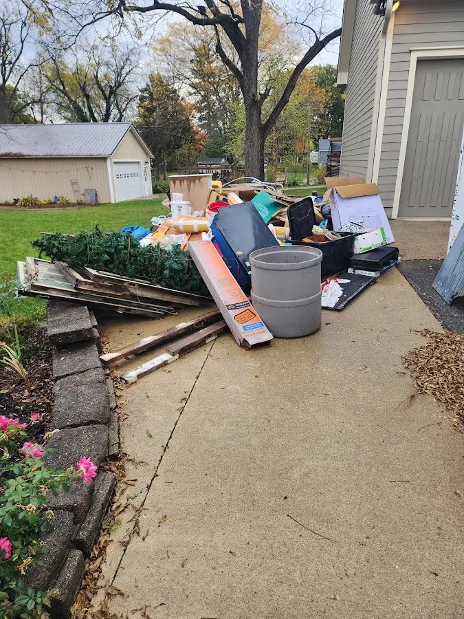 Dumpster being loaded with debris for 3 Yard Dumpster Rental in Linthicum